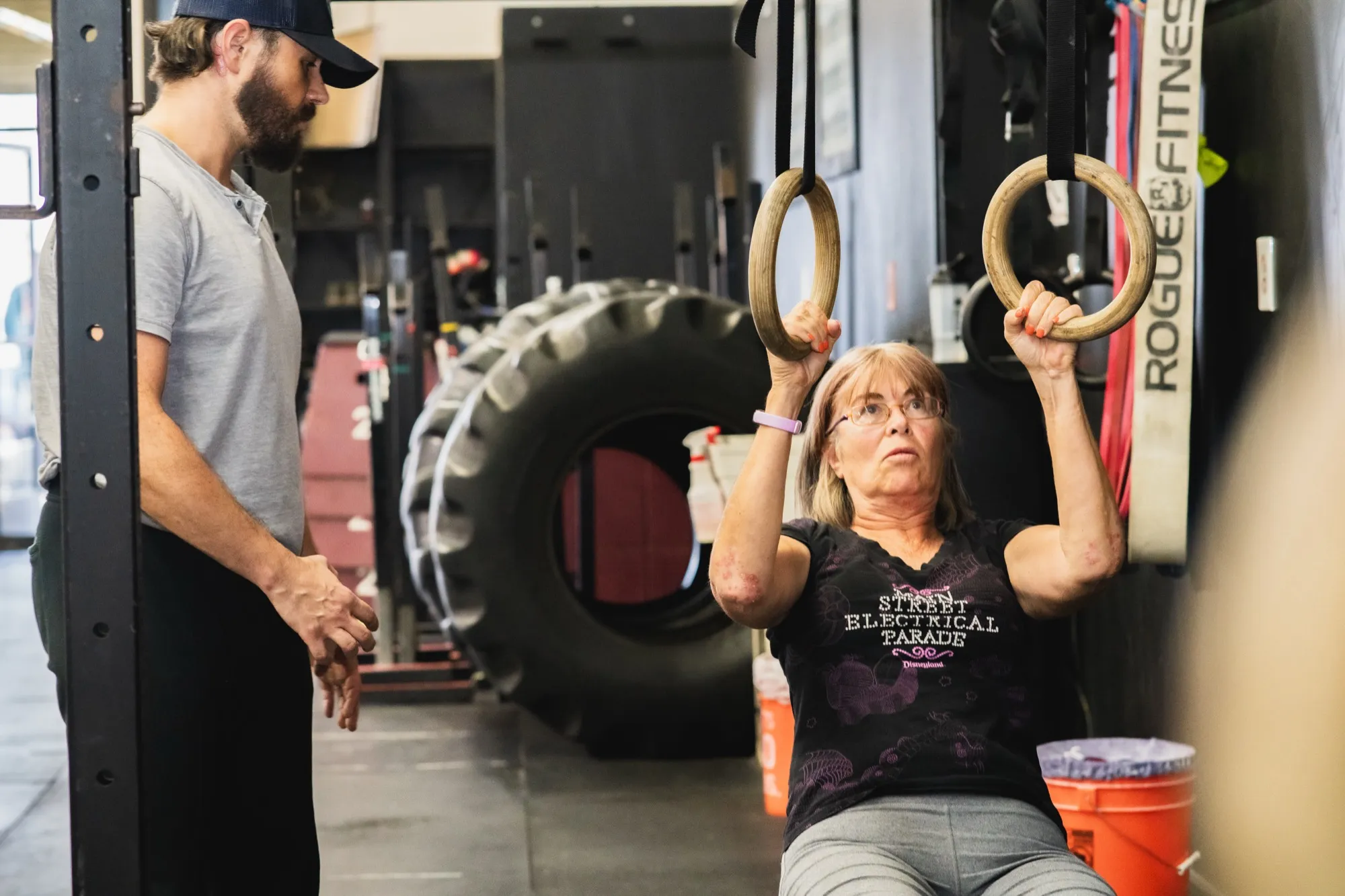 Trent McCarthy demonstrating strength training to a client at TWM facility