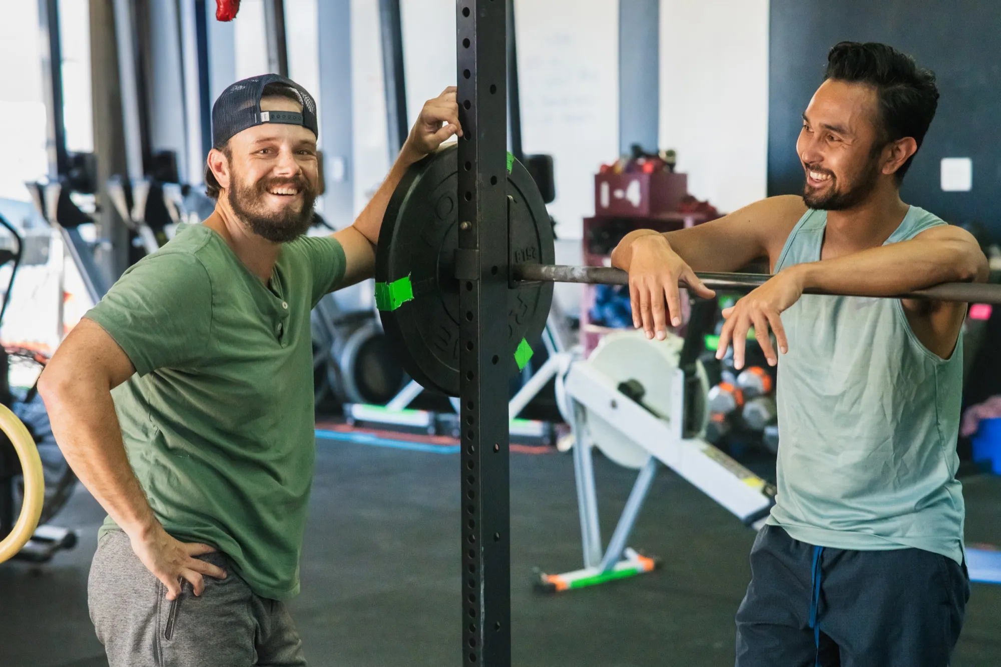 TWM Client and Trent celebrating training progress with barbell