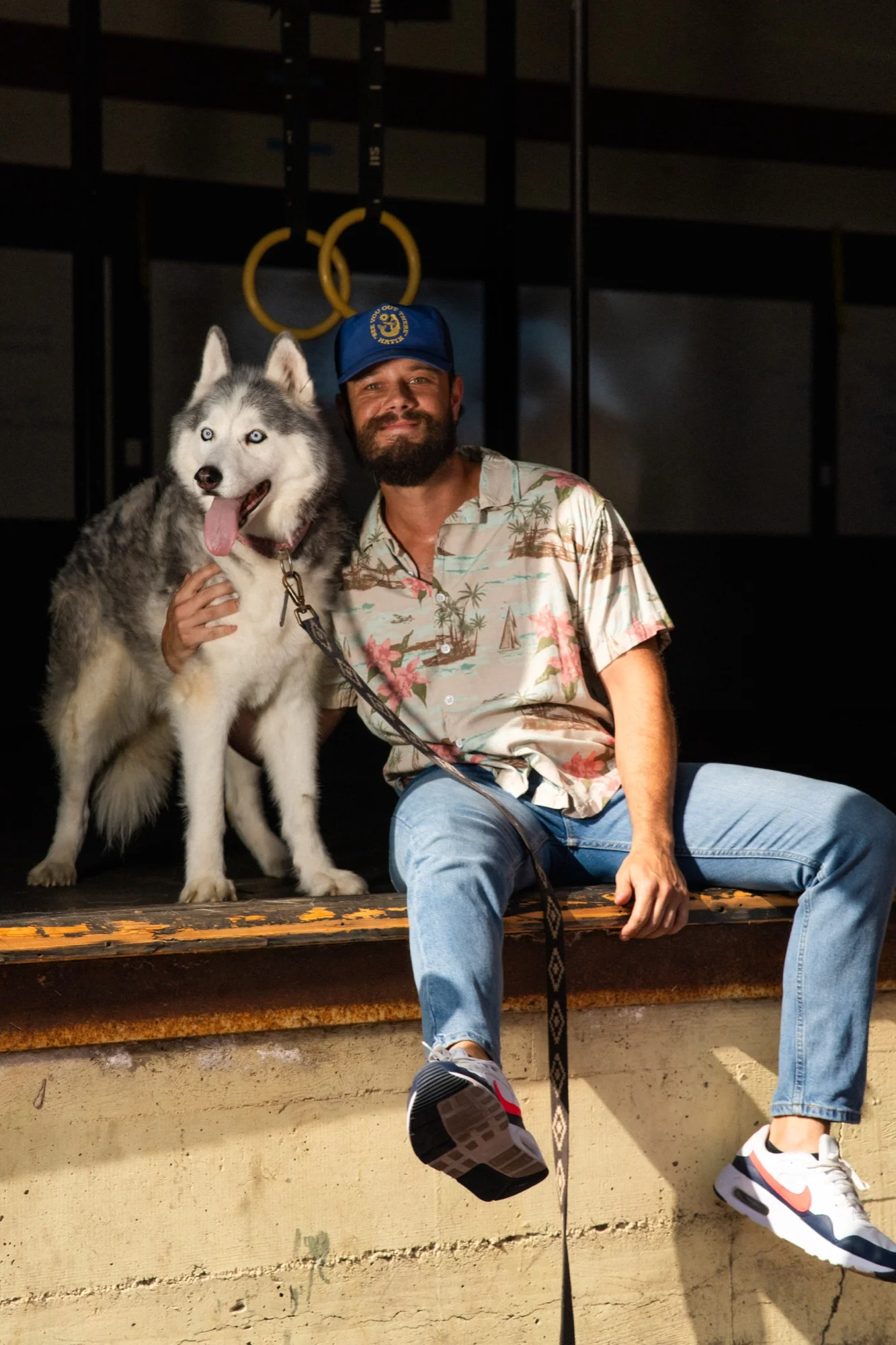 Trent McCarthy with his dog, showcasing his personal side outside of fitness training